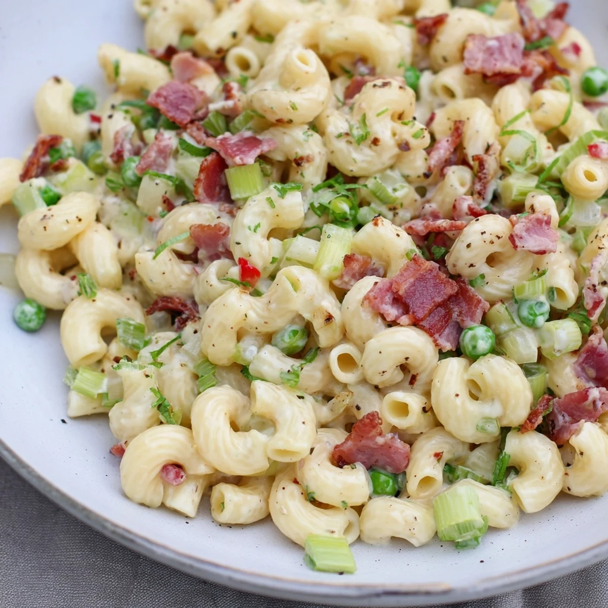 Perfectly creamy Easy Bacon Macaroni Salad, featuring crispy bacon pieces with colorful veggies.
