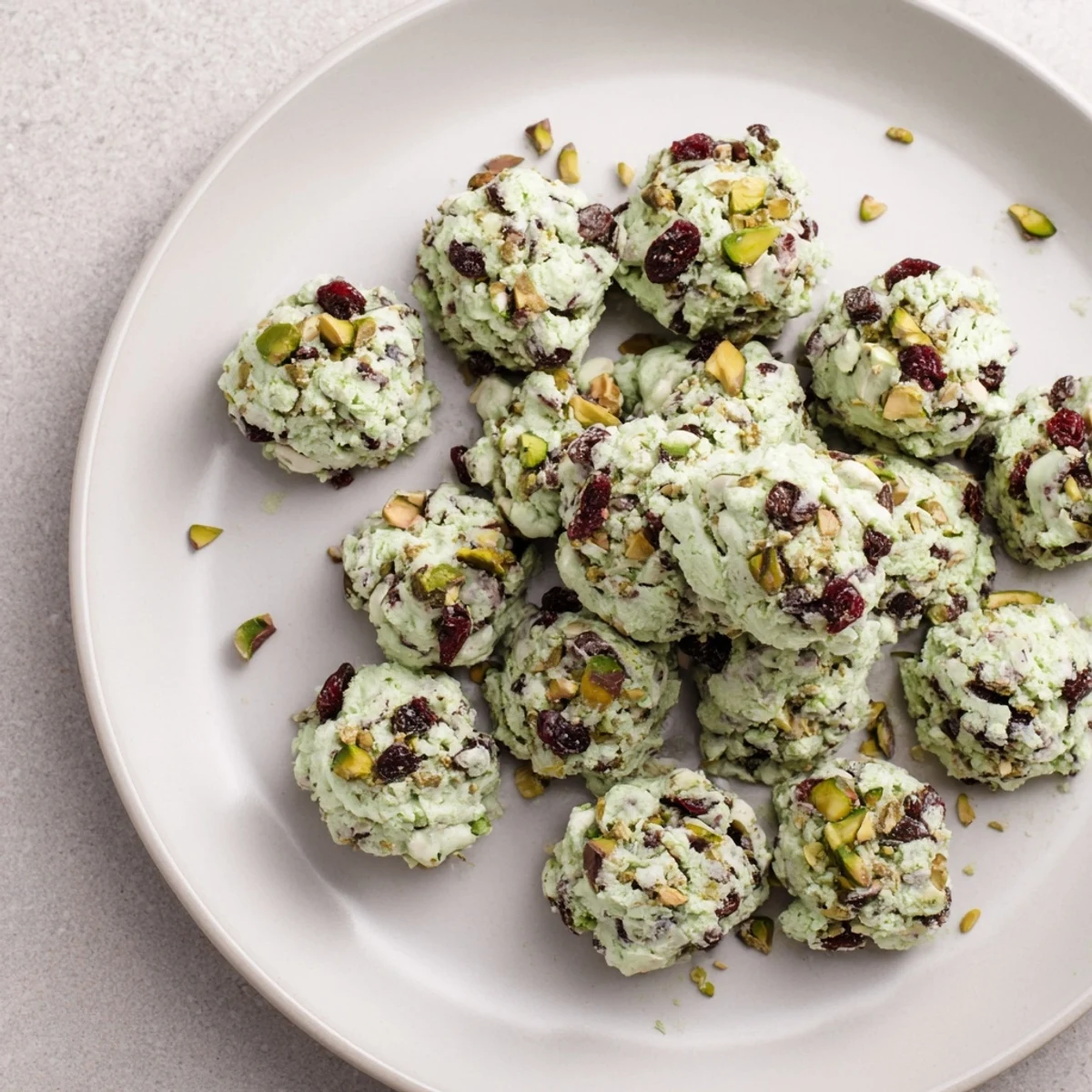 Matcha White Chocolate Cranberry Bark Clusters, a vibrant treat with green matcha and ruby cranberries.
