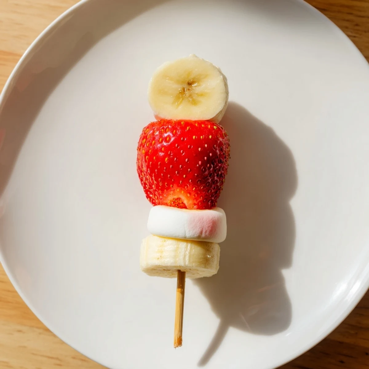 Easy Strawberry Banana Santa Sticks: Sweet, refreshing fruit on skewers, a colorful party appetizer.