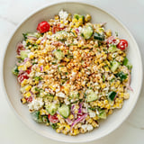 Vibrant image of a Mexican Street Corn Chopped Salad, showcasing charred corn and Cotija cheese garnish.