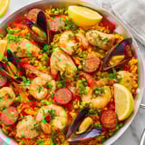 Golden rice and savory seafood mingle in this delicious Paella Spanish Rice, perfect for sharing.