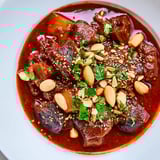 A hearty bowl of Moroccan Lamb Tagine, showcasing the rich flavors of a North African stew.