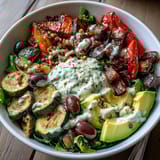 Colorful ingredients for a Vegan Mediterranean Buddha Bowl are roasted with oregano and ready to be assembled.