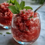 Juicy, slushy Watermelon Mint Frosé garnished with fresh mint leaves, ready to enjoy.