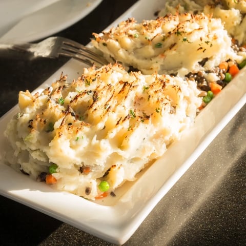 Warm, bubbling Hearty Mushroom and Lentil Shepherds Pie, perfect for a comfort food craving on a cool evening.