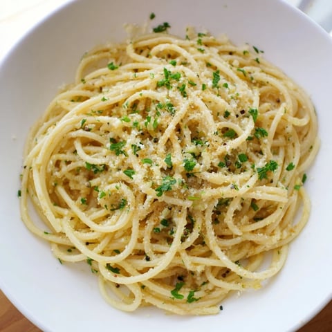 Golden strands of 4-Ingredient Garlic Butter Pasta, coated in glistening, savory garlic butter sauce.