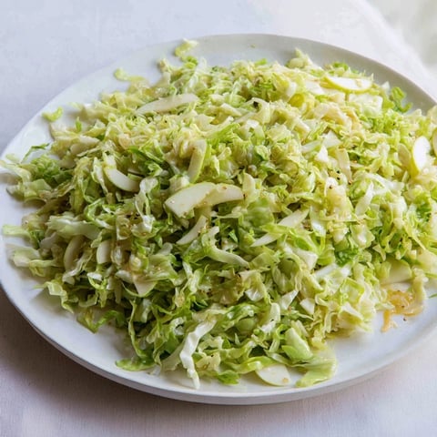 Steaming Sweet and Sour Bavarian Red Cabbage and Apple, a flavorful side dish with glistening apples and vibrant red cabbage.