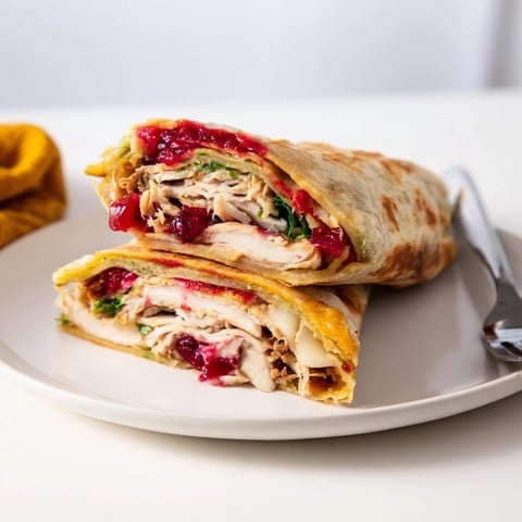 Golden-brown Turkey, Stuffing & Cranberry Leftovers Tortilla Wrap, crispy and oozing melted cheese.