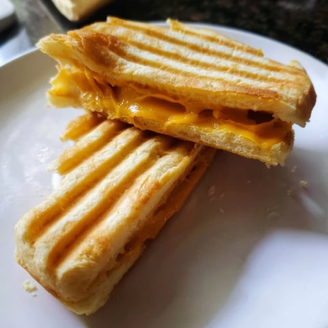 Crispy waffle grilled cheese oozing melted cheddar; a comforting American classic for lunch.