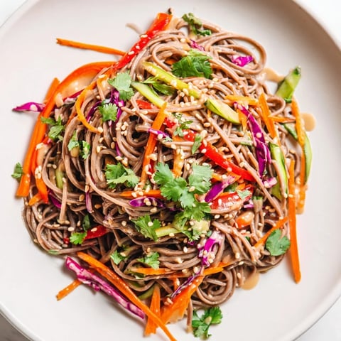Vibrantly colored soba noodle salad with crisp vegetables, perfect for a light vegetarian meal.
