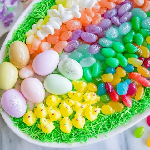 Festive, colorful egg-shaped candy platter perfect for Easter with pastel chocolate eggs.