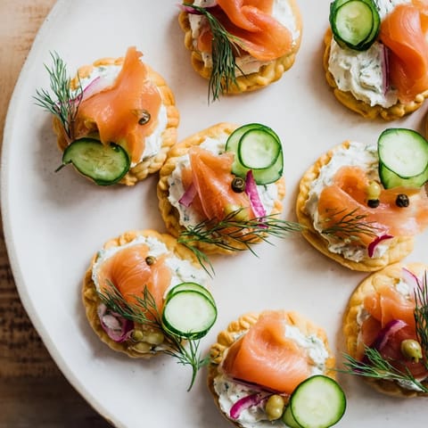 Golden Étoiles Filantes Assiette de Fin dAnnée appetizer starring flaky pastry stars and creamy smoked salmon.