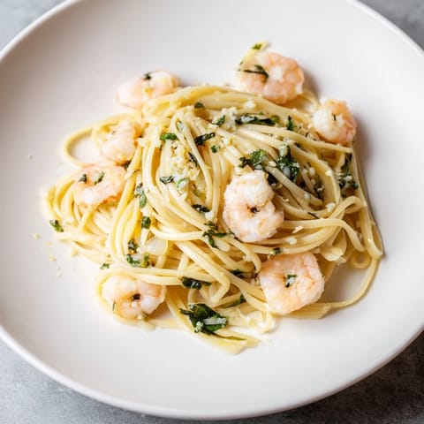 Close-up of Lemon Herb Pasta with Shrimp, showing the tender shrimp and bright lemon sauce coating each noodle.