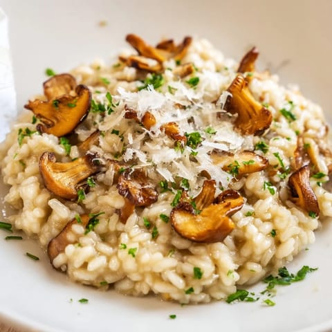 Creamy mushroom risotto, a comforting Italian rice dish garnished with fresh parsley and Parmesan.
