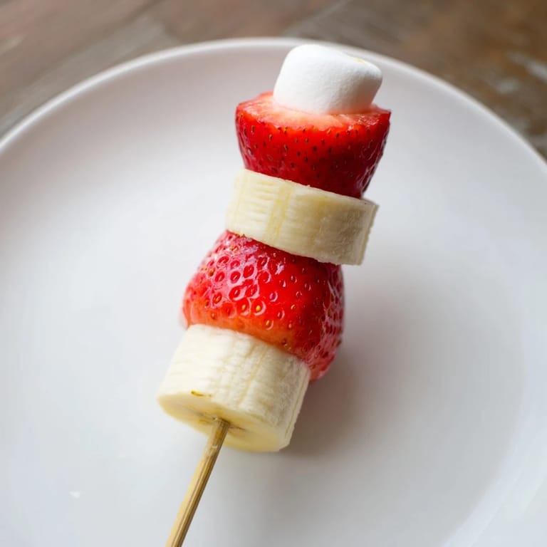 Festive close-up: Homemade Strawberry Banana Santa Sticks, a delightful holiday snack for kids.