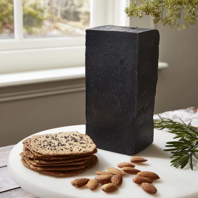 Imagine the Obsidian Peak: a cheese tower surrounded by crackers and charcoal almonds, ready to serve.