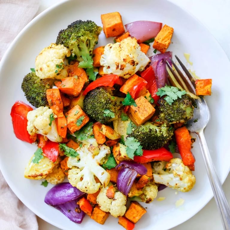 Colorful Anti-Inflammatory Turmeric Roasted Vegetables in a white bowl, ready to be paired with quinoa for a wholesome vegan meal.